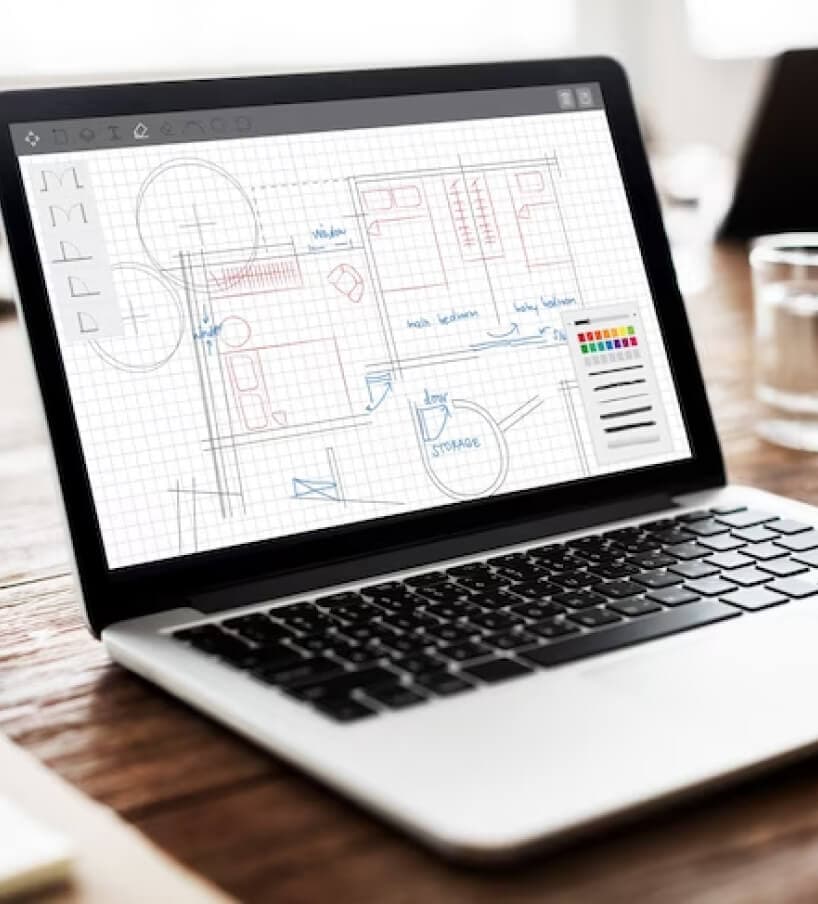 Construction estimator reviewing architectural drawings